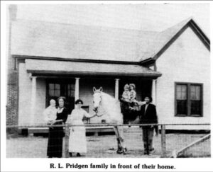 R.L. Pridgen Family in front of their home